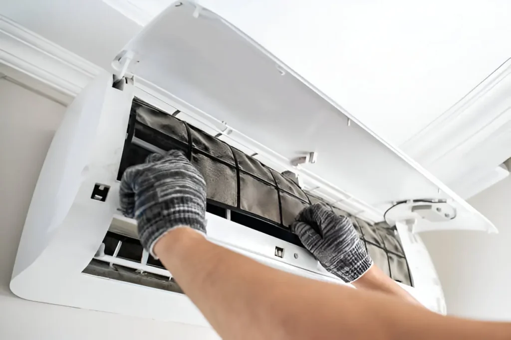 AC Maintenance 1 Expert technician performing AC maintenance on residential air conditioner.
